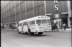 Free Spirit Press bus driving down the street