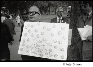 Older man hawking 'I hate you, I hate you' buttons at George Wallace rally, Boston Common (advertising a new book by Munro Lead)