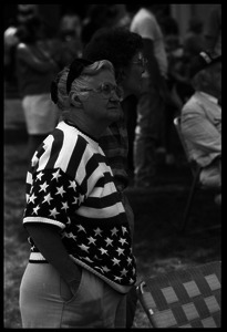 Older woman in American flag sweater watching the Chesterfield's Fourth of July parade
