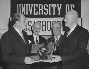 Ralph A. Van Meter with two or three professors and gift