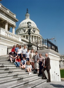 Congressman John W. Olver with group of visitors, posed on the steps of the United States Capitol building