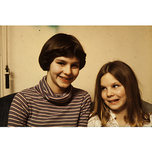 Portrait of two children smiling for photograph