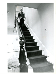 Florence Freitas walking down stairs at Commonwealth House