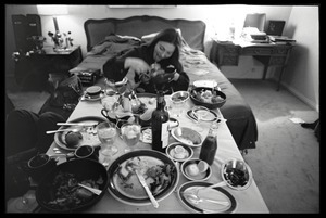 Judy Collins: horsing around after a meal, seated at a dinner table set up in her room at the Beverly Hills Hotel