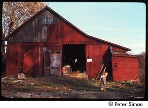 Child walking past the barn, Packer Corners commune