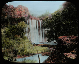 Havasu Falls in Grand Canyon (waterfall over red rock, green vegetation)