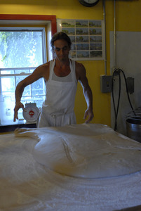 Hungry Ghost Bread: owner and baker Jonathan C. Stevens working dough for cinnamon rolls