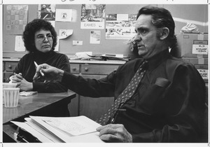 Robert W. Mallary sitting indoors with a woman