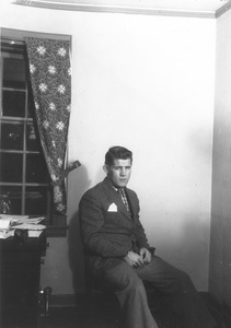 Thomas E. Devaney sitting indoors