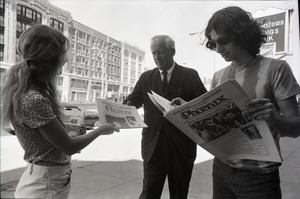 Boston Phoenix promotional photos: Phoenix hawker handing paper to man, Stephen Davis (r) reading