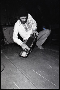 Beach Boys at Boston College: Mike Love kneeling with keyboard