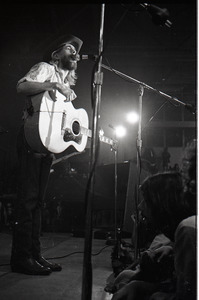 New Riders of the Purple Sage opening for the Grateful Dead at Sargent Gym, Boston University: John 'Marmaduke' Dawson playing acoustic guitar and singing