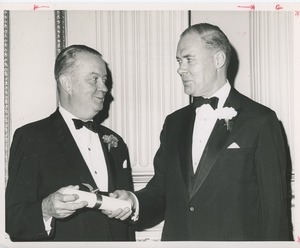 Unidentified men in tuxedos at an ICD event