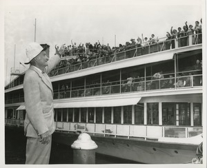 Bruce Barton waves to ship