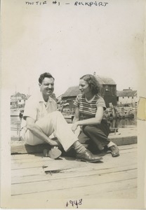 David and Bernice Kahn seated on a dock in Rockport