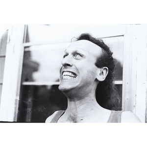 Head and shoulders portrait of Abe Rybeck gritting his teeth