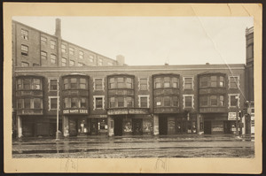 Exterior view of commercial buildings and storefronts between 187 and 195 Massachusetts Avenue