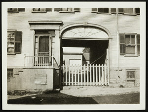 Exterior view of an unidentified building, with an archway, Portsmouth, N.H., undated