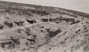 View of a dozen artillery dugouts built into a hillside