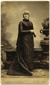 Full-length studio portrait of Martha E. Otis (Mattie O. Dickinson)