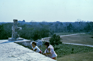 Visitors climbing the lowest pyramid