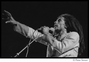 Bob Marley in concert, gesturing to the audience