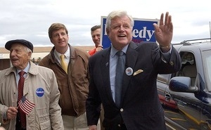 Sen. Edward M. Kennedy waves to supporters as he arrives at his son Patrick Kennedy's campaign headquarters in Pawtucket: at left is long-time supporter Frank DiPaolo, 98, Patrick Kennedy in background