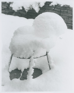Metal chair under snow blanket