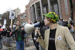 UMass student strike: strike organizer with a bullhorn, leading the march outside the Student Union building