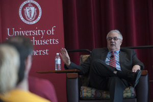 View from the audience of Congressman Barney Frank seated on the Student Union Ballroom stage, UMass Amherst, during his book event