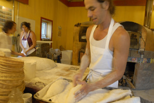 Hungry Ghost Bread: owner and baker Jonathan C. Stevens preparing bread dough for proofing