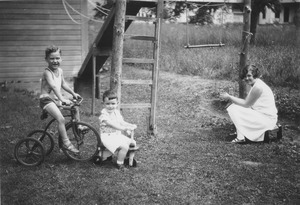 Student observing children outdoors