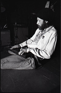 Beach Boys at Boston College: Mike Love kneeling with keyboard