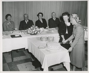 Cutting cake at awards banquet