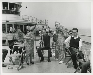 Accordion player and clown on boat ride