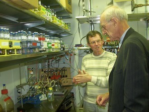 Congressman John W. Olver in the laboratory with Derek Lovely (Microbiology, UMass Amherst)