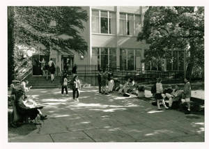 Students hanging outside of Woods Hall