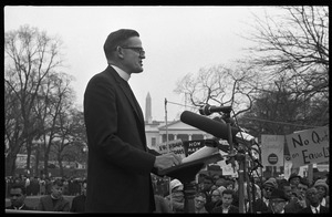 Priest addressing the crowd from the dais during a civil rights demonstration in front of the White House on Lafayette Square