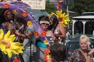 Purple Feather chocolate shop float in the parade : Provincetown Carnival parade