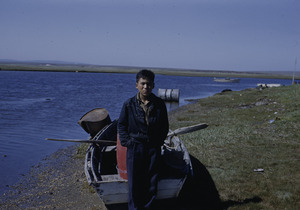 Villager posing with his fishing skiff