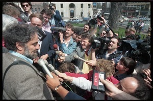 Scene outside the Hampshire County courthouse following acquittal in the CIA protest trial: Abbie Hoffman being interviewed by the press