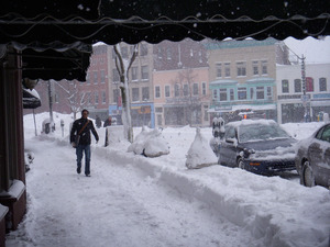 Pedestrian on the sidewalk along Main Street near Crafts Ave., Northampton, Mass., in heavy snow