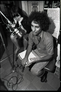 Abbie Hoffman: unidentified woman and Hoffman (right) at the microphone, WBCN