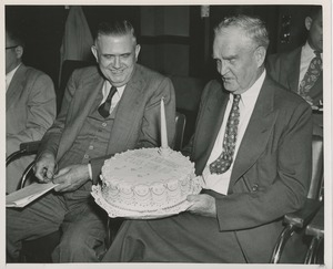 Bruce Barton holding a birthday cake