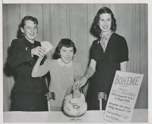Young girl pulling tickets out of a bowl for a raffle