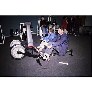 Adults using exercise machines
