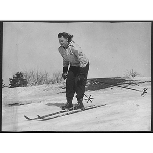 Woman skiing down hill