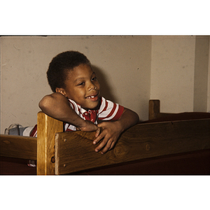 Boy looking over a couch