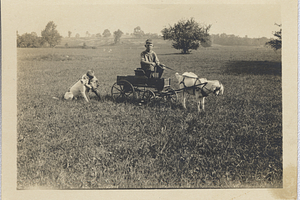 Robert with dog and Art G. Rosenburg in goat cart