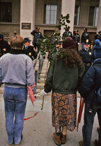 Woman with a leafy branch in protest at Pentagon
